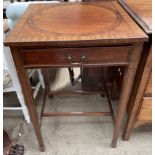 An early 20th century mahogany side table the square top above a frieze drawer on square tapering