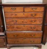 A 19th century oak chest on chest, with a moulded cornice above two short and three long drawers,