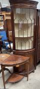 An Edwardian rosewood corner table with inlaid decoration,