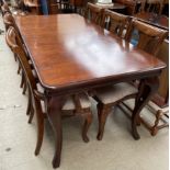 A reproduction mahogany extending dining table of rectangular form with cabriole legs together with