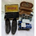 A pair of 19th century child's clogs together with opera glasses,