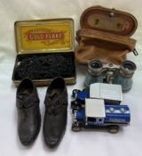 A pair of 19th century child's clogs together with opera glasses,