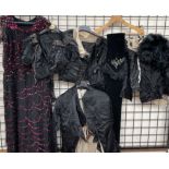 A collection of Victorian clothing including jackets, dress,