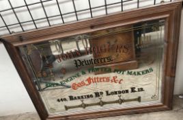 An advertising mirror for "John Rogers, Pewterers, beer engine & pewter pot makers...