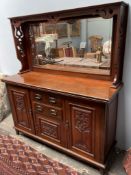 An Edwardian mahogany mirrorback sideboard with pierced decoration,