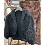 A fur stole together with a jacket