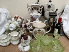 A Staffordshire spaniel together with part tea sets, green glass dressing table set,