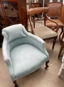 An Edwardian upholstered salon chair together with a Regency mahogany elbow chair and a French