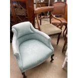 An Edwardian upholstered salon chair together with a Regency mahogany elbow chair and a French