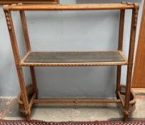 A French oak hall stand, with three rails and a central shelf,
