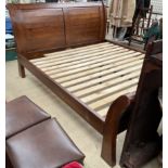 A super king size hardwood sleigh bed