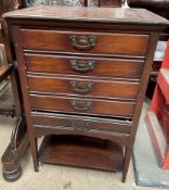 A mahogany music cabinet with five drawers and a shelf on square legs