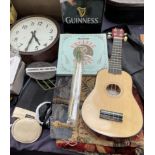 A ukelele together with a belgian tapestry, totopoly boafrd game, other board games, records, tins,