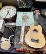 A ukelele together with a belgian tapestry, totopoly boafrd game, other board games, records, tins,