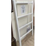 A large white painted two section clothes horse