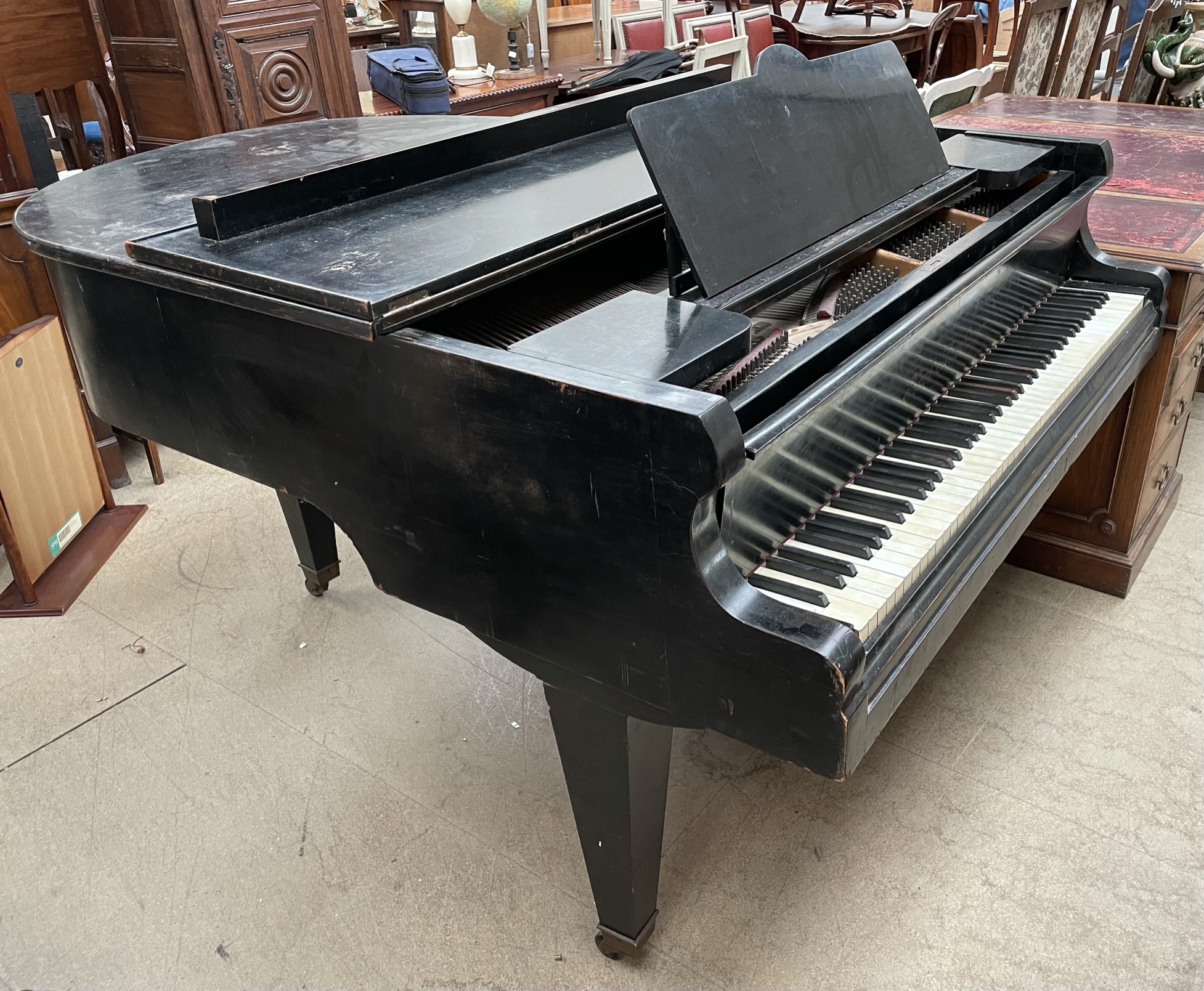 A Karl Hamburger ebonised baby grand piano, metal framed,