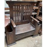 An oak hall settle,