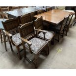 A 20th century oak extending dining table and eight chairs