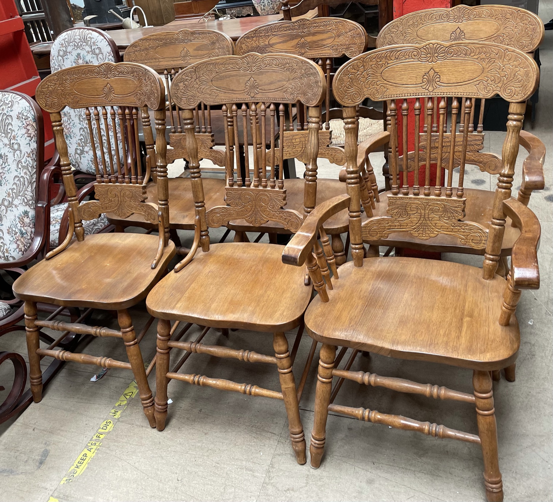 A set of six modern stick back dining chairs,