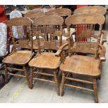 A set of six modern stick back dining chairs,