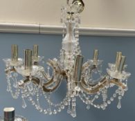 A glass lustre drop chandelier with eight branches together with another glass lustre drop