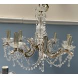 A glass lustre drop chandelier with eight branches together with another glass lustre drop