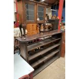 A rustic bookcase with four shelves together with a display cabinet on cabriole legs