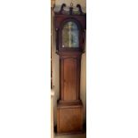 A 19th century mahogany longcase clock, the hood with a broken swan neck pediment and ionic columns,