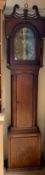A 19th century mahogany longcase clock, the hood with a broken swan neck pediment and ionic columns,