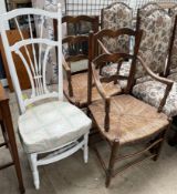 A pair of ladder back chairs with rush seats together with a white painted bedroom chair