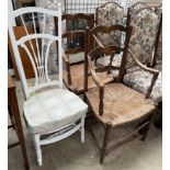 A pair of ladder back chairs with rush seats together with a white painted bedroom chair