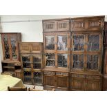 A 20th century oak wall unit with multiple sections,