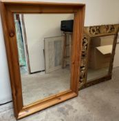 A pine framed wall mirror together with a leaf and shell carved gilt framed wall mirror