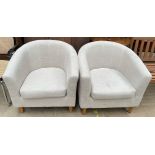 A pair of upholstered tub chairs