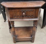 A 20th century oak side table with a frieze drawer on turned legs united by an undertier
