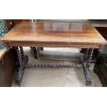 A Victorian rosewood side table with a rectangular top and rounded corners on barley twist legs