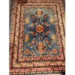 A Chinese rug, with a blue ground and geometric patyterns with multiple guard stripes,