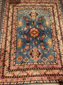 A Chinese rug, with a blue ground and geometric patyterns with multiple guard stripes,