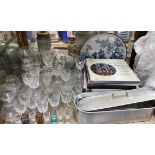 A collection of crystal drinking glasses together with a glass decanters, fish kettle, records,