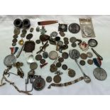 A pair of silver candlestick sconces together with coins, commemorative medals,
