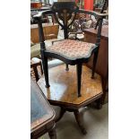 An Edwardian cornet chair with a floral inlaid back,