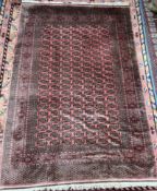 A large red ground Turkoman rug, signed,