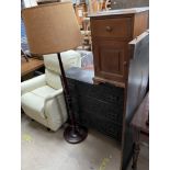 A 17th century and later ebonised carved oak chest with three long drawers together with a pine