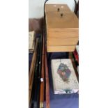 A sewing box together with walking sticks and a floral painted tin