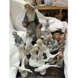 A large Lladro figure of a nun and a child together with a Lladro figure of a girl feeding ducks,