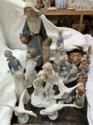 A large Lladro figure of a nun and a child together with a Lladro figure of a girl feeding ducks,