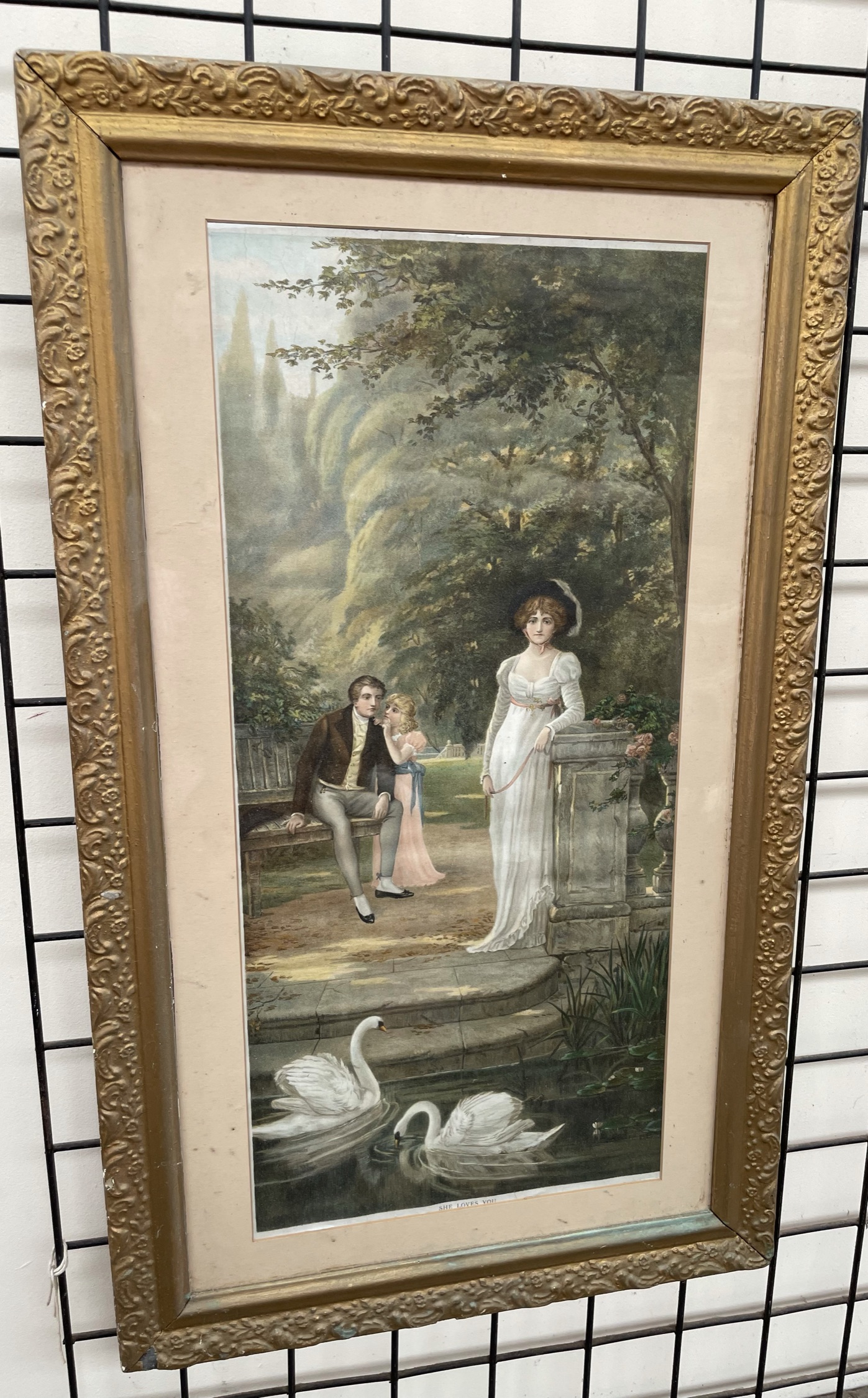 A print of a family with swans in the foreground,