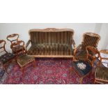 A Biedermeier style salon suite comprising a three seater settee,