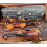 A violin, with a two piece back, bears a label for Leslie Sheppard,