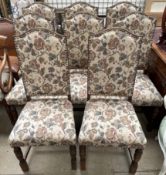 A set of eight 20th century oak dining chairs with floral tapestry upholstery